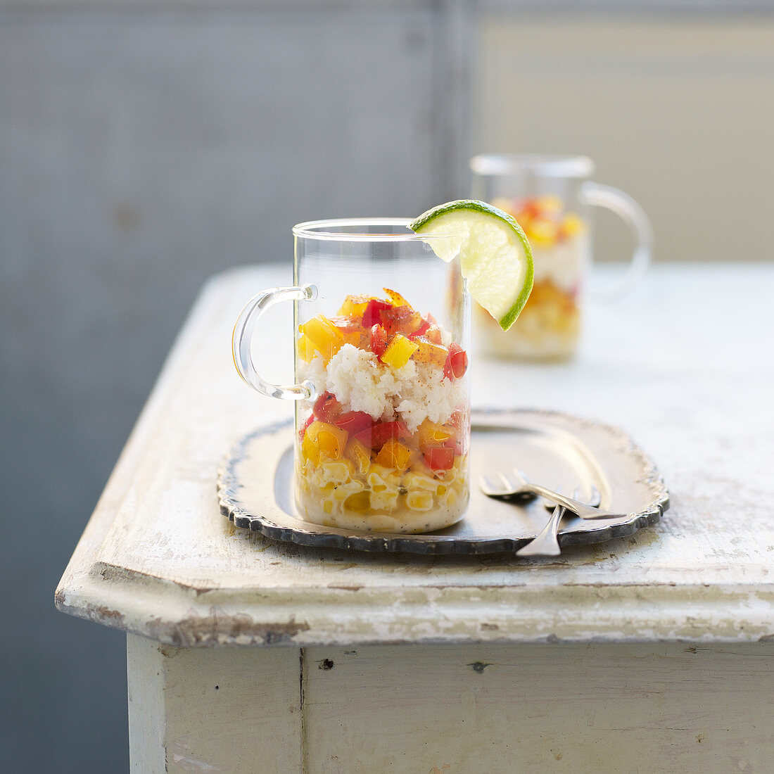 Corn salad with crab meat and peppers in glass cups