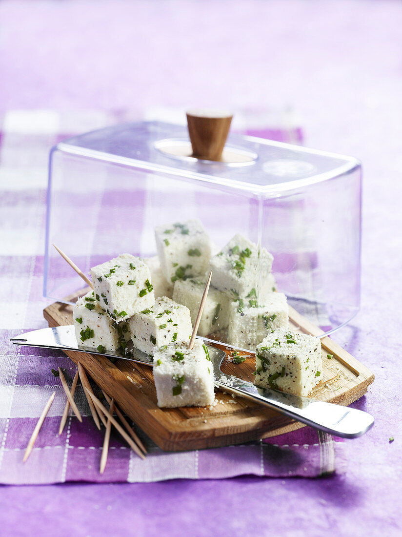 Salty marshmallow cubes with parmesan and herbs
