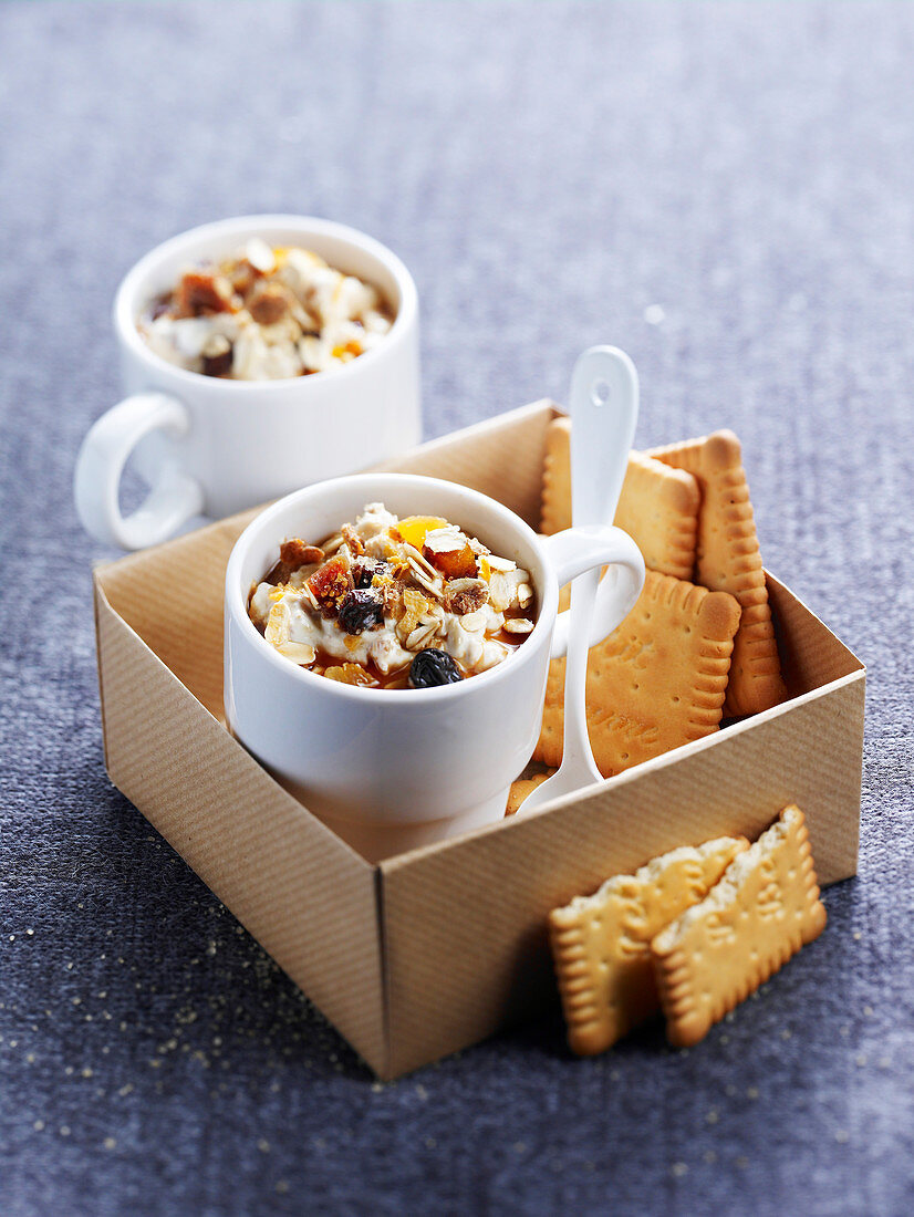 Muesli with dried fruits and nuts served with butter biscuits