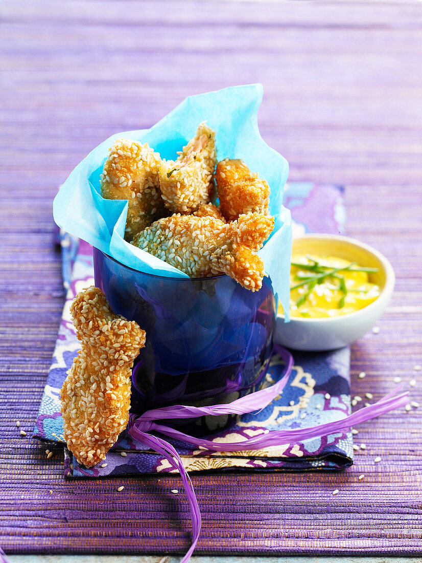 Salmon and cod nuggets with sesame breading