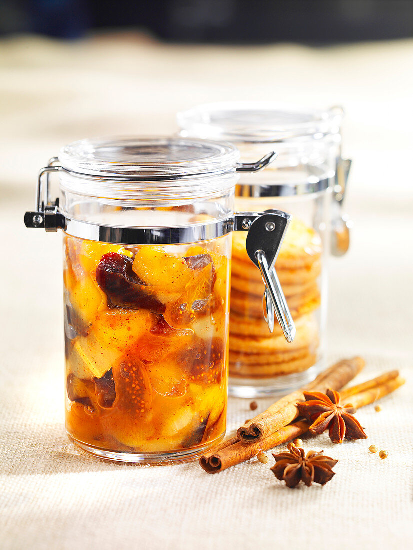 Dried fruit compote with spices in preserving jars