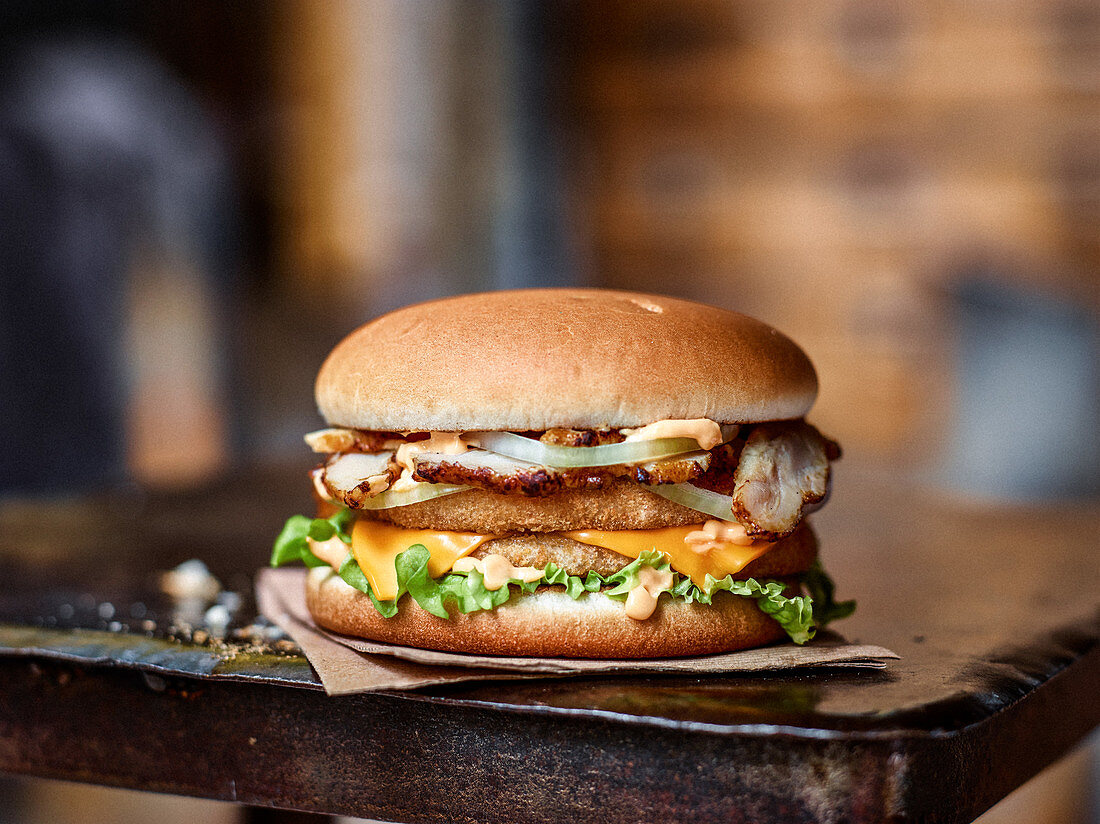 Grilled chicken burger with cheese and onions