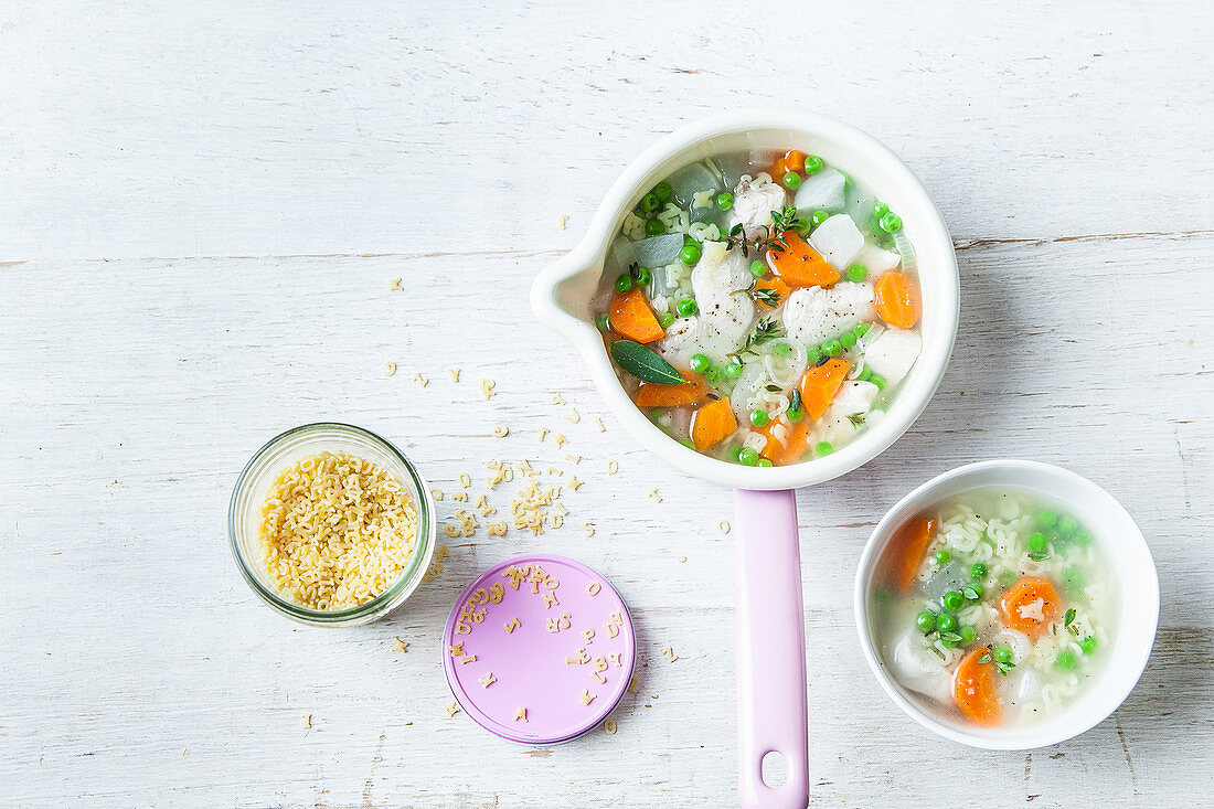 Chicken soup with vegetables and alphabet pasta