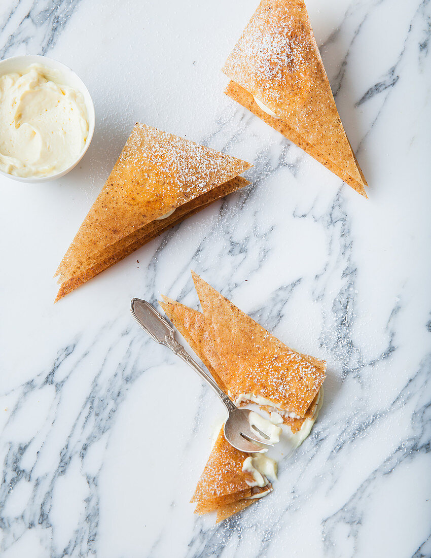 Crispy puff pastry triangles with lemon curd filling