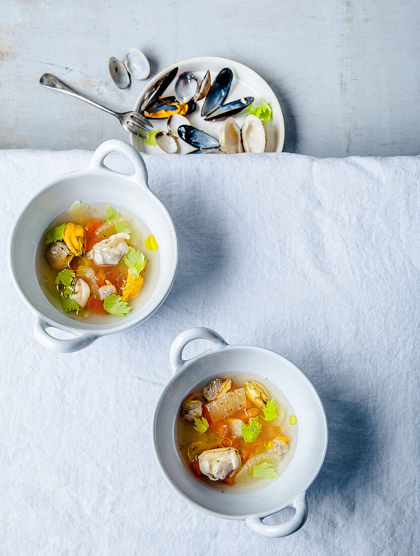 Prawn broth with mussels and raw tomatoes