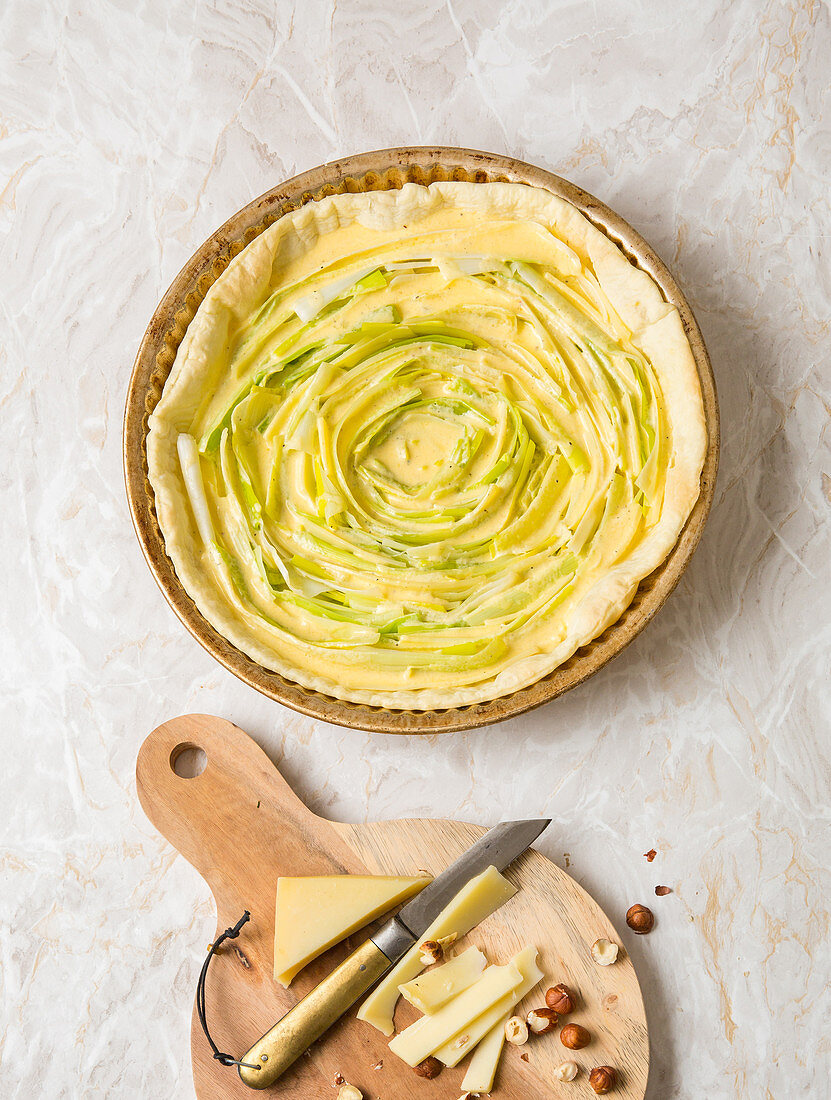 Unbaked leek tart with hazelnuts and cheese