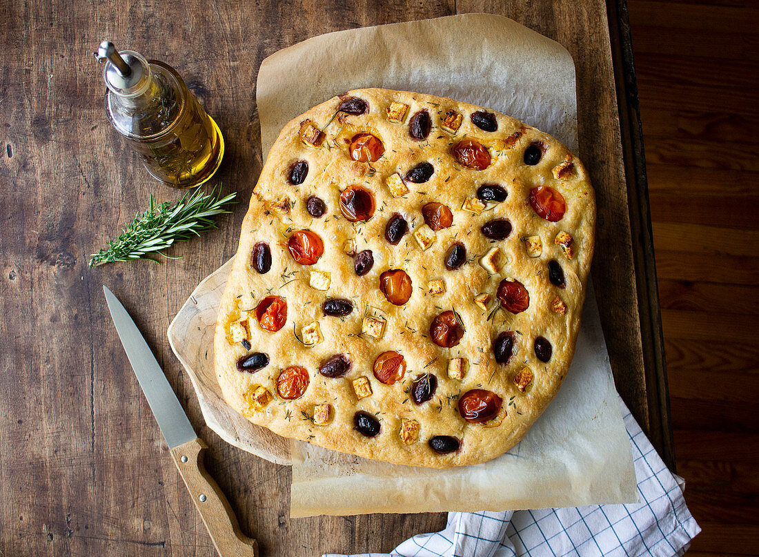 Focaccia with cherry tomatoes, black olives and feta cheese