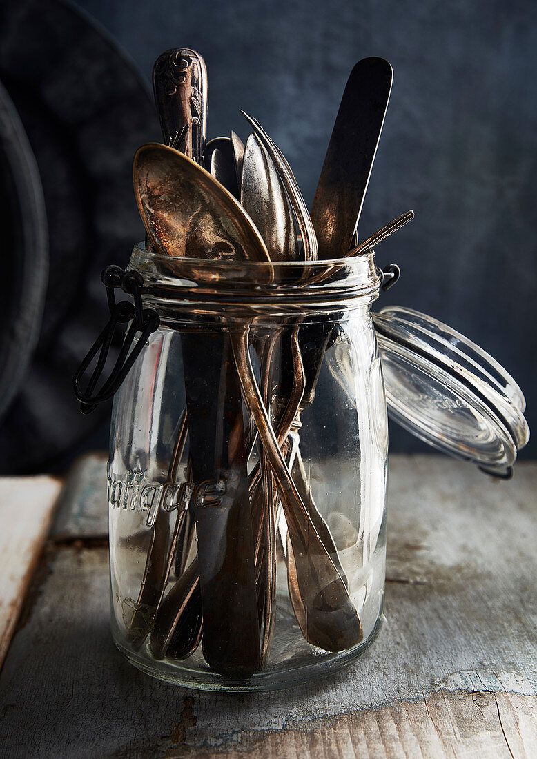 Vintage silverware in a hanger jar