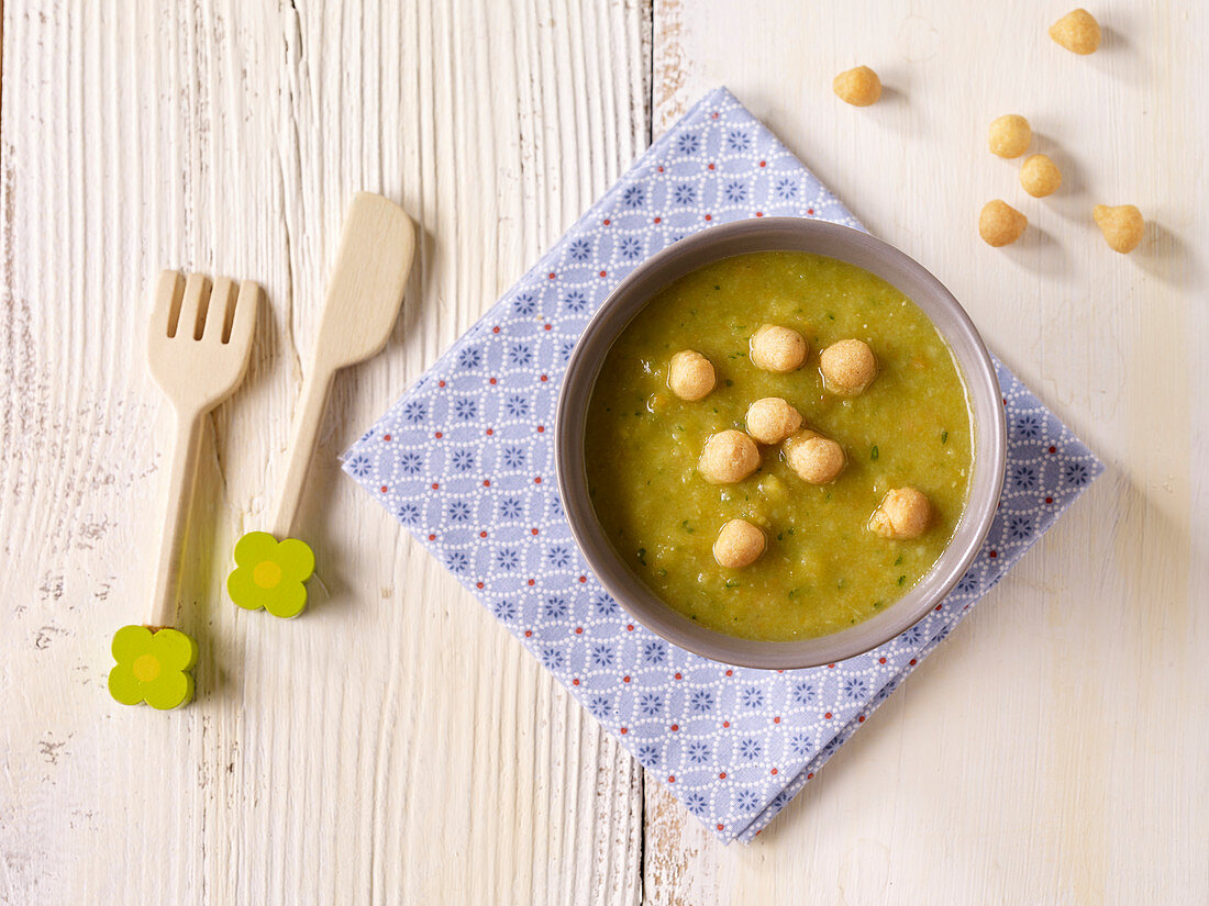 Cream of vegetable soup for children with leek, carrot, celery and chickpeas