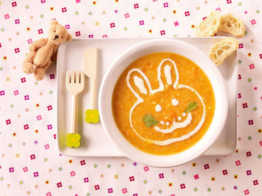 Cream of carrot soup with parsnips and lentils for children