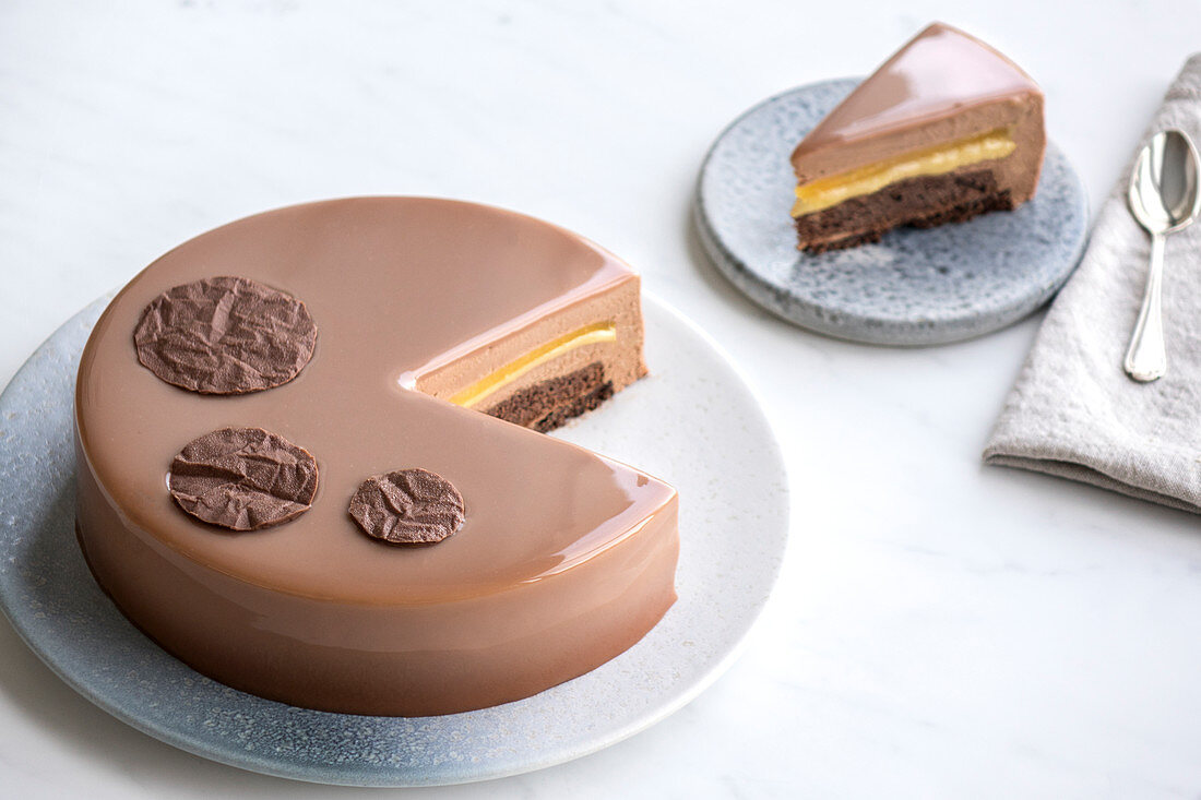 Chocolate cake with milk chocolate and passion fruit