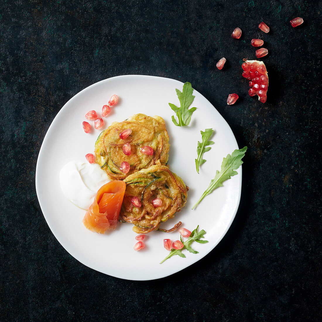 Zoodle pancakes with smoked salmon and pomegranate seeds