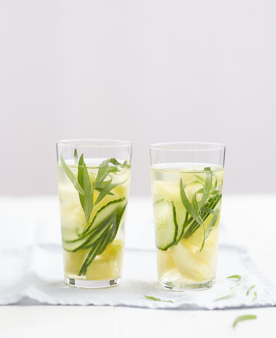 Iced summer drinks with cucumber, pineapple and tarragon
