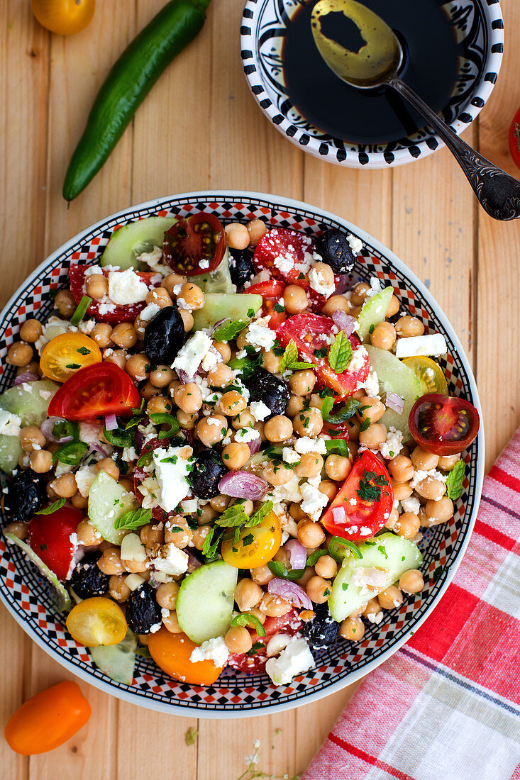 Chickpea salad with tomatoes, cucumber, chickpeas, olives and feta