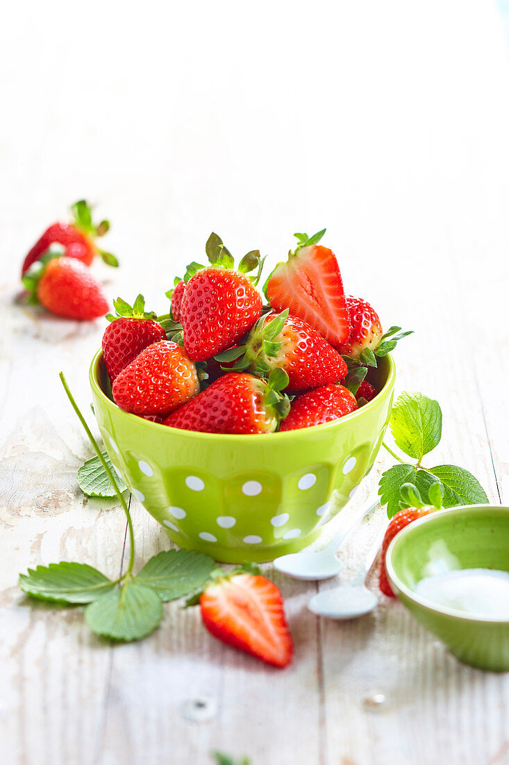 Strawberries in a dotted green bowl