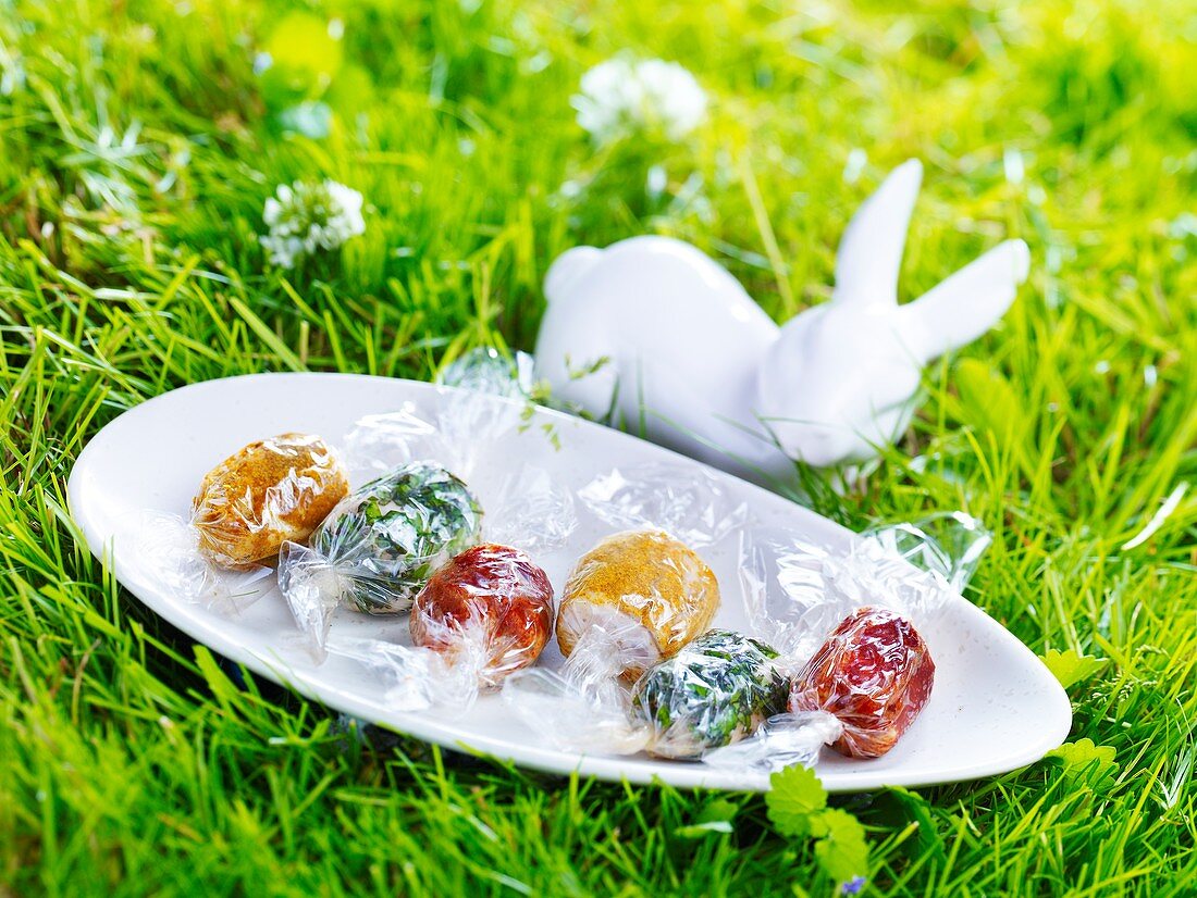 Assorted savoury Easter sweets on a plate in grass