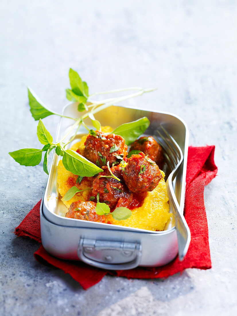 Meatballs in tomato sauce with polenta