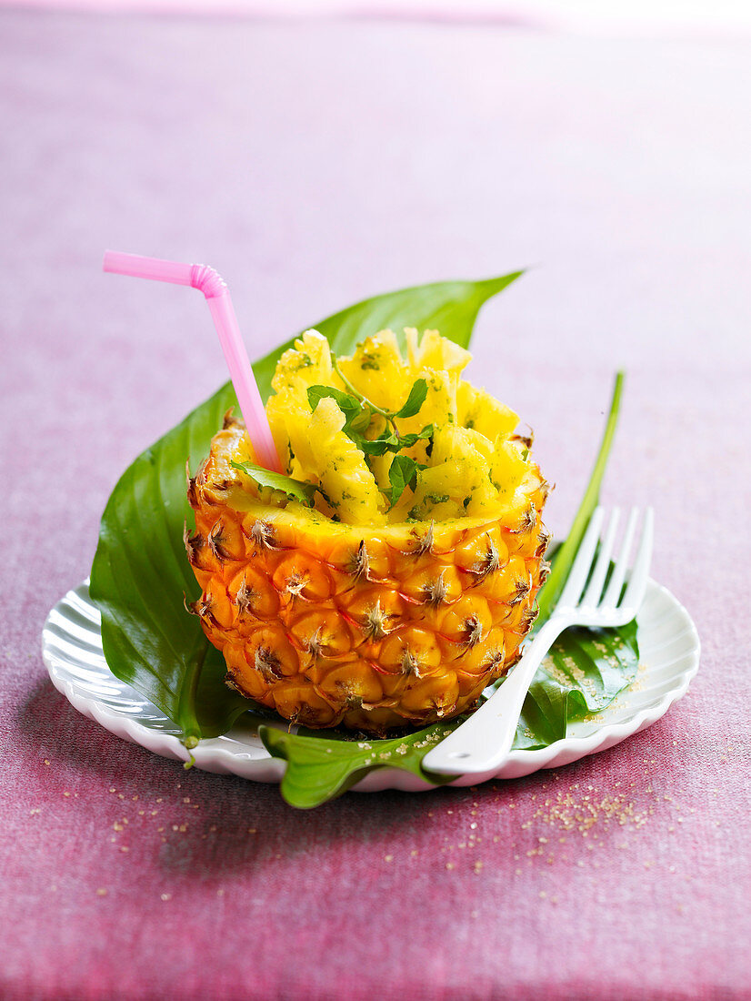 Pineapple salad served in a hollowed out pineapple