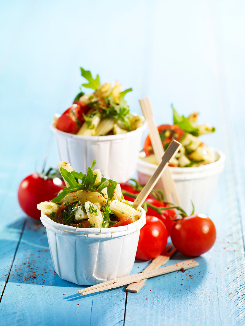 Summer pasta salad with penne, rocket and cherry tomatoes