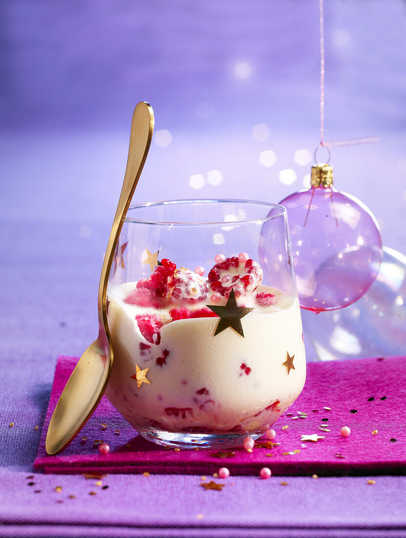 Christmas sabayon with raspberries in a dessert glass