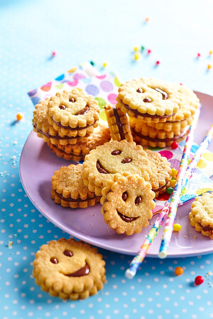 Smiley sandwich biscuits with milk chocolate filling