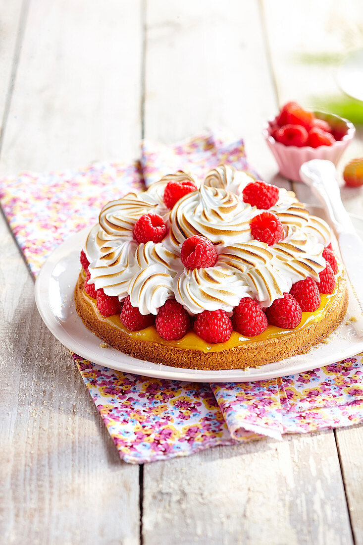 Lemon tart with raspberries and meringue