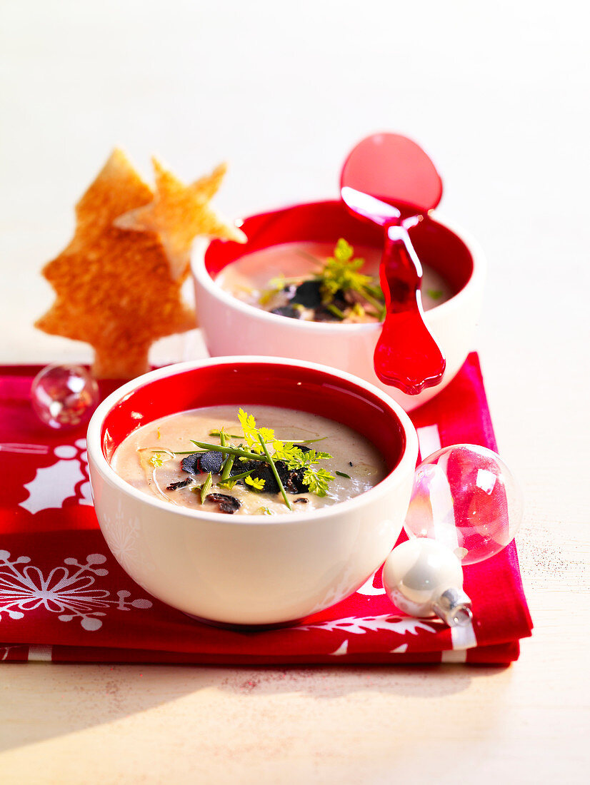 Christmas mushroom soup with thinly sliced truffles