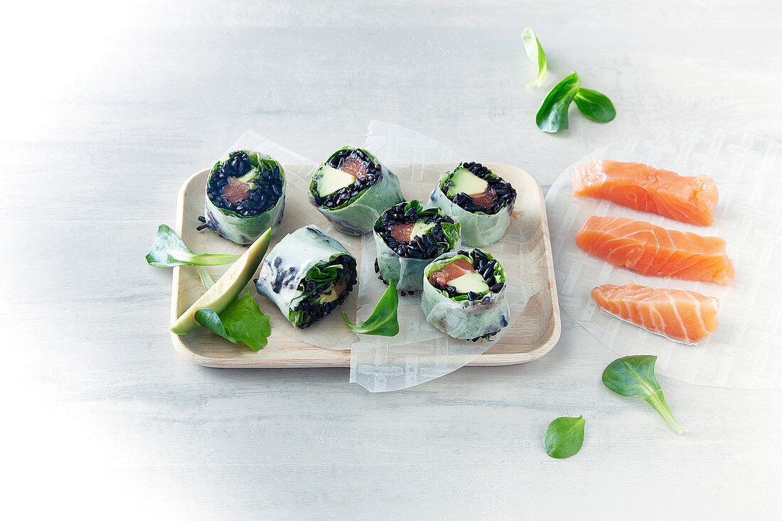Sushi with black rice, salmon and avocdo (Japan)