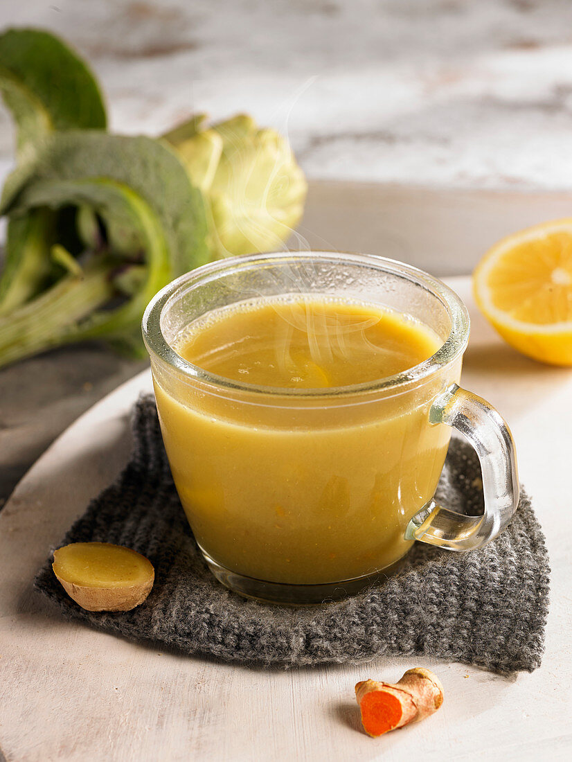 Atichoke broth with miso, turmeric, ginger and lemons