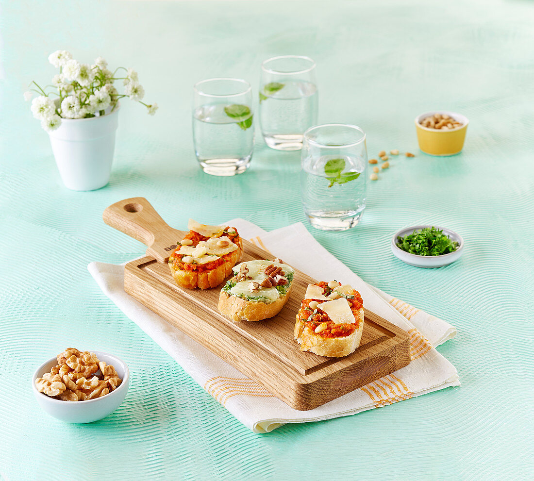 Assorted crostinis on a wooden board