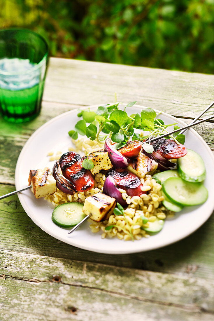Halloumi skewer with chorizo and red onions served with wheat salad with cucumber