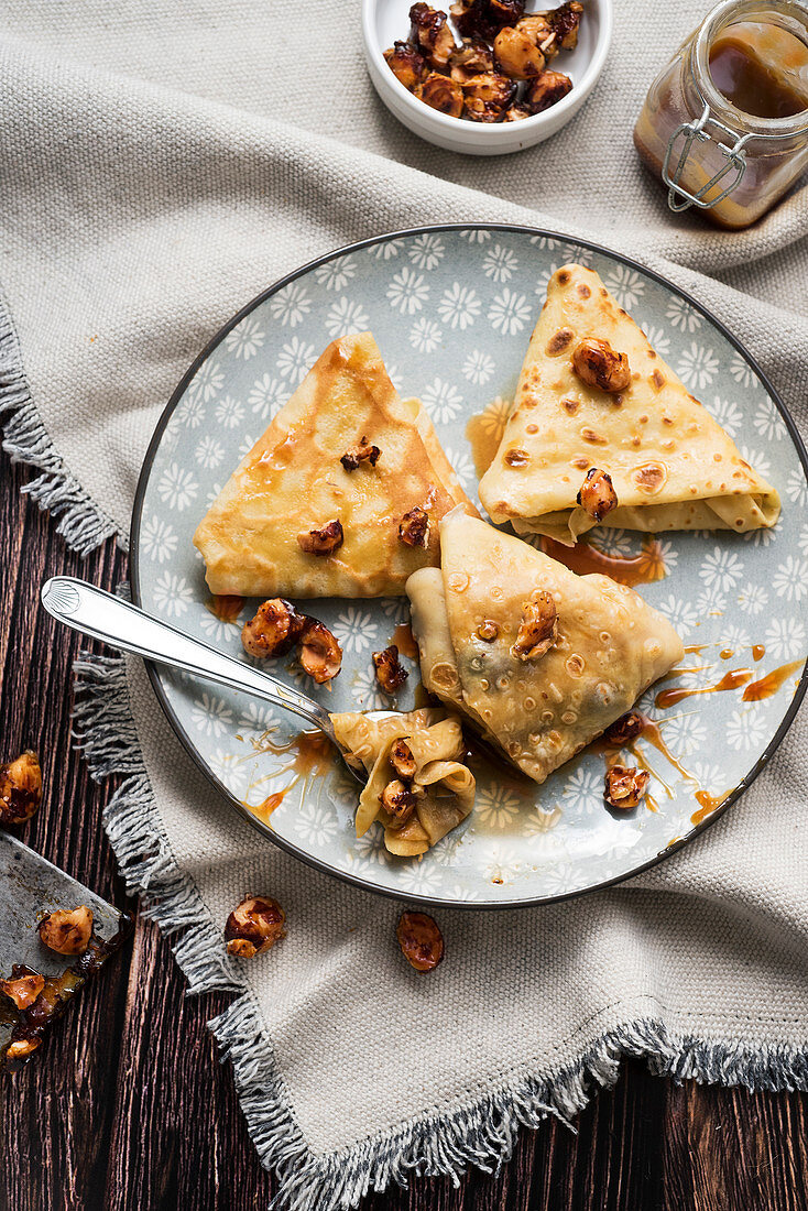 Caramel crepes with salted butter and hazelnuts