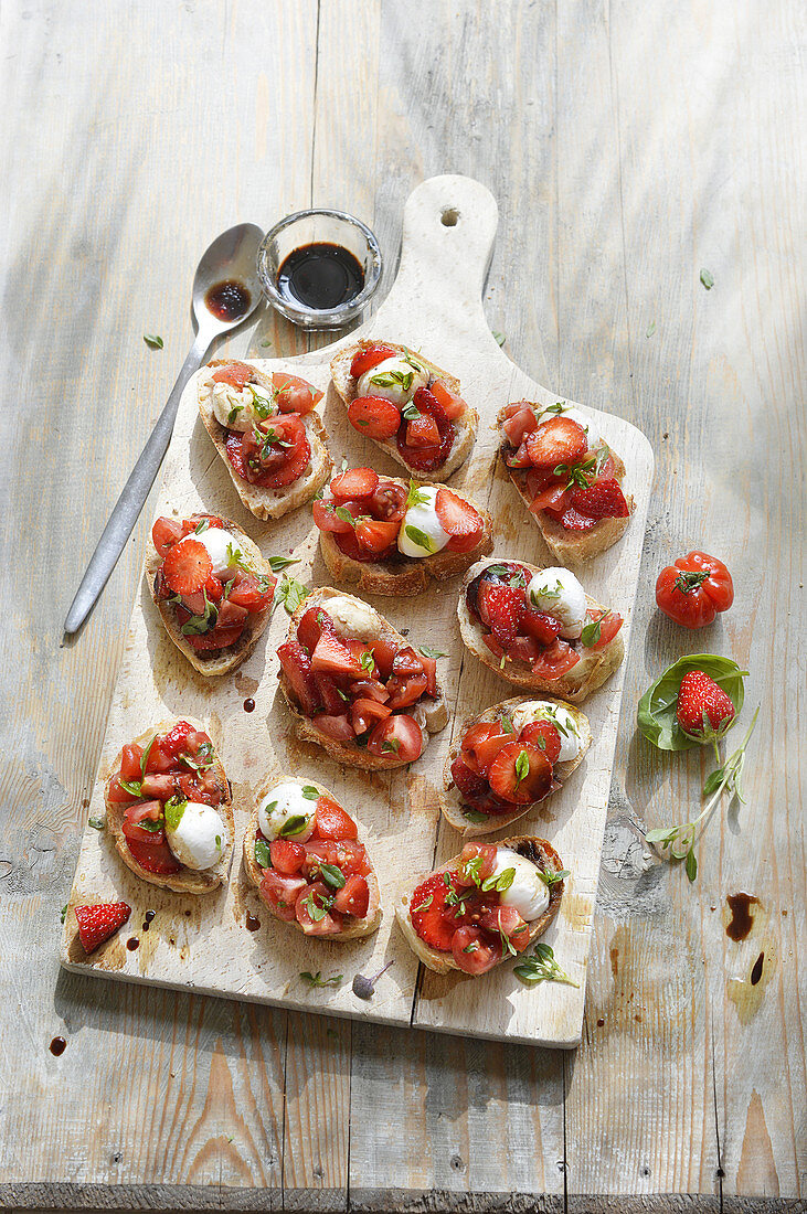 Sweet bruschetta with strawberries, mozzarella and balsamic vinegar