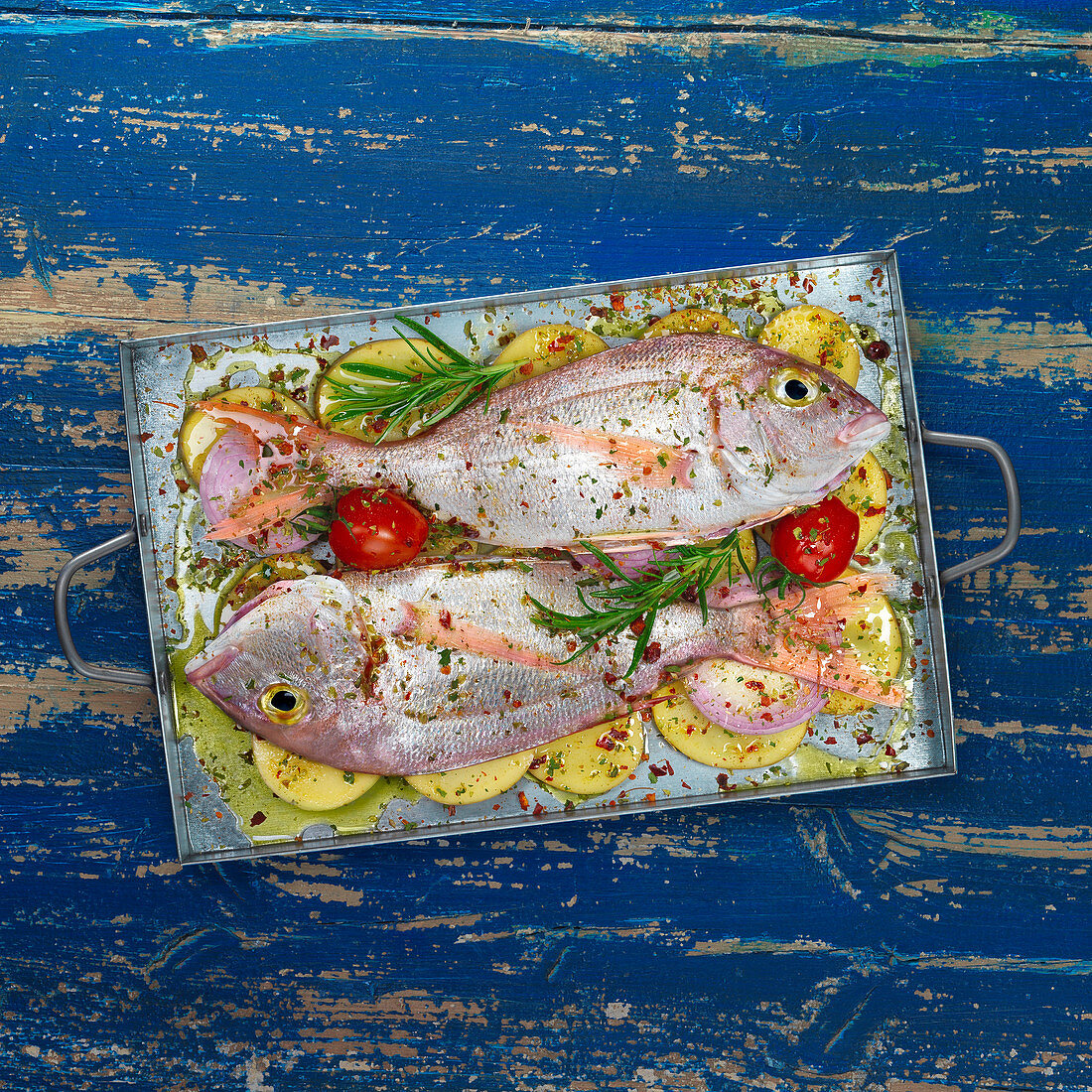 Pink sea bream with potatoes and herbs