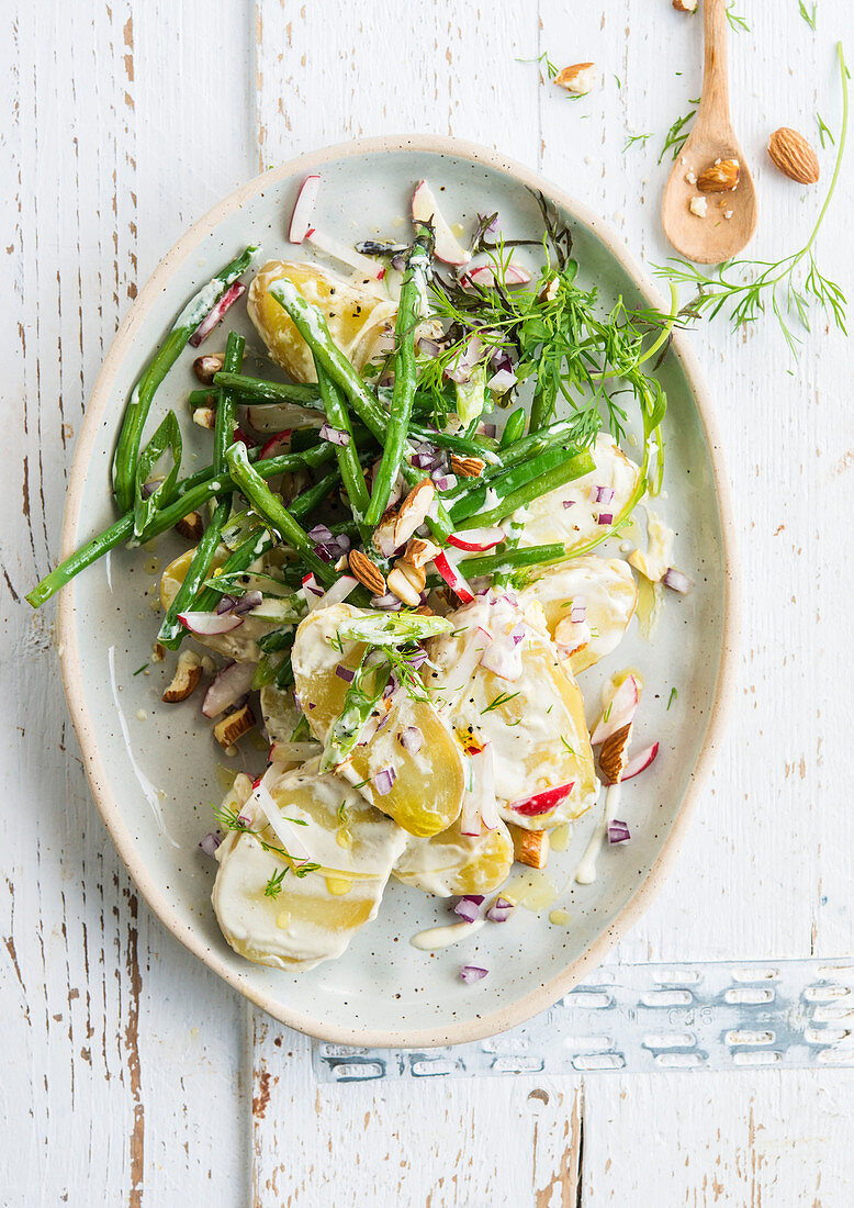 Creamy potato salad with green beans and almonds