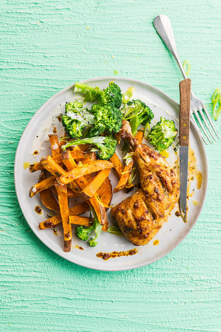 Chicken leg with sweet potato fries and broccoli