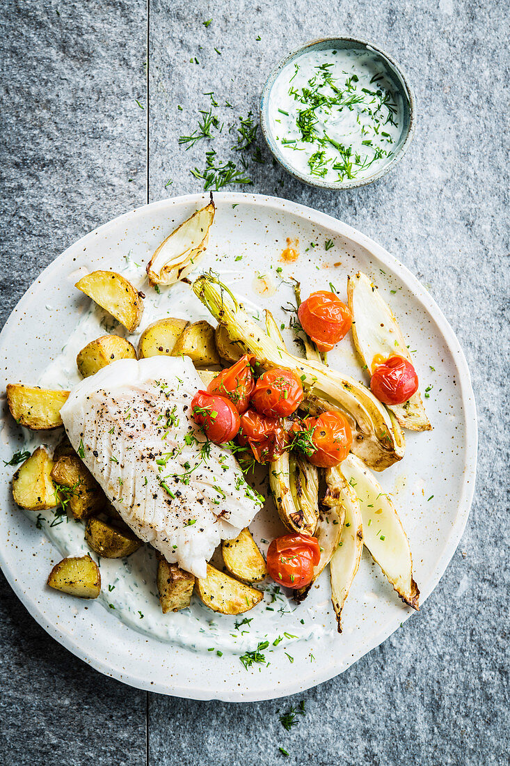 Fish fillet with fennel, cherry tomatoes and roast potatoes