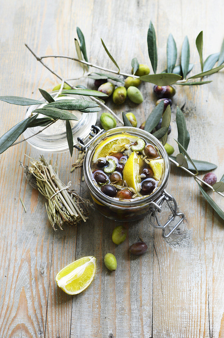 Olives marinated with lemons and fennel in a preserving jar