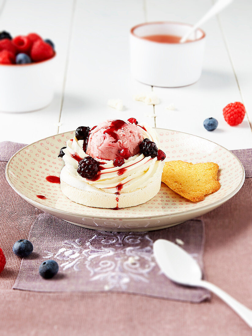 Mini pavlova with ice cream and red berries