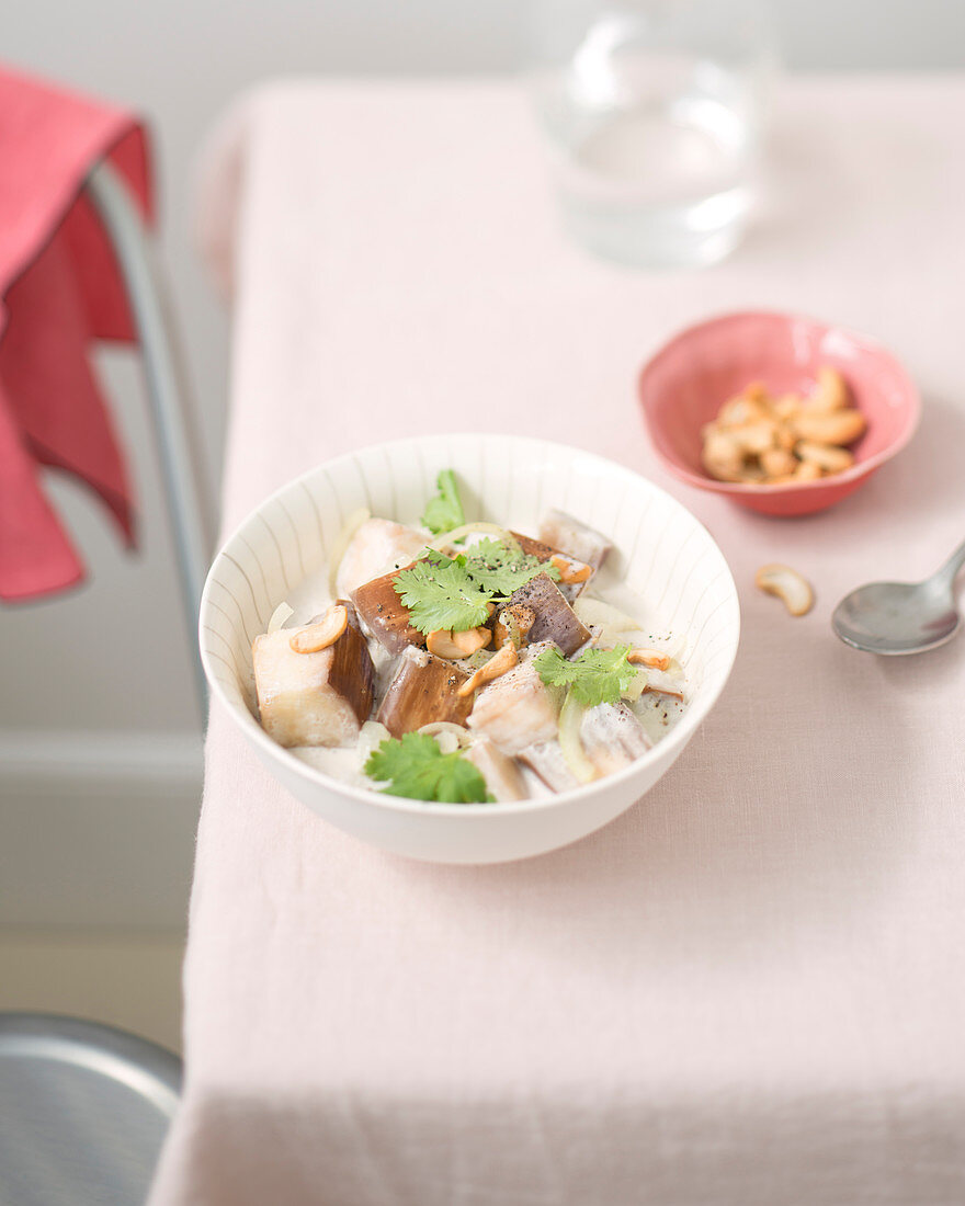 Aubergines in coconut milk with cashew nuts