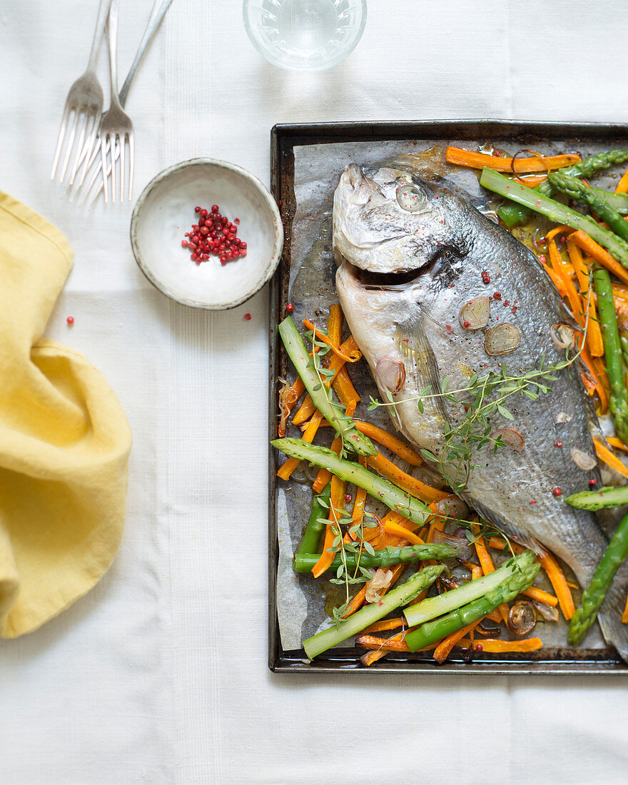 Baked sea bream with spring vegetables