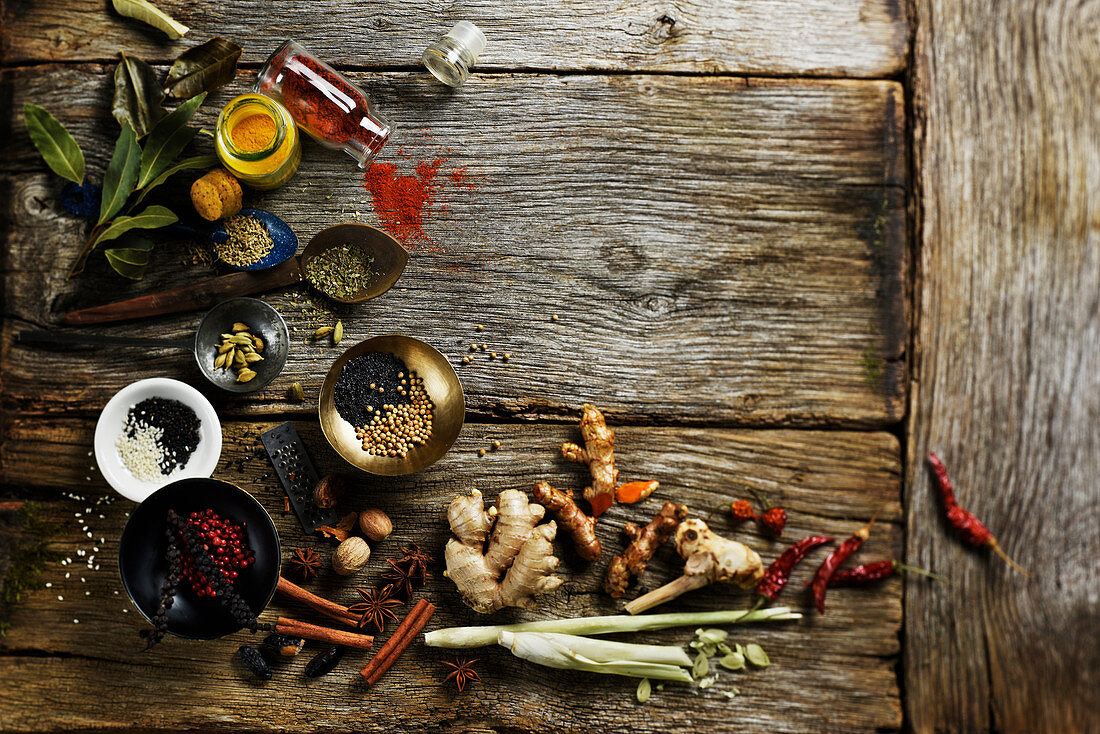Still life with various spices on a wooden background