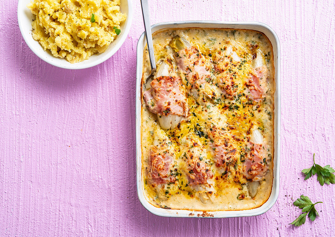 Chicory gratin with ham served with mashed potatoes
