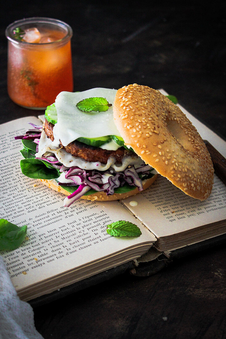 Vegetarian bagel sandwich with an orange and thyme drink