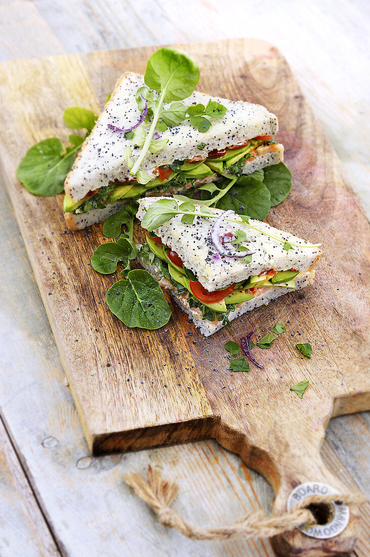 SandwIch with watercress, avocado, salmon and tomatoes