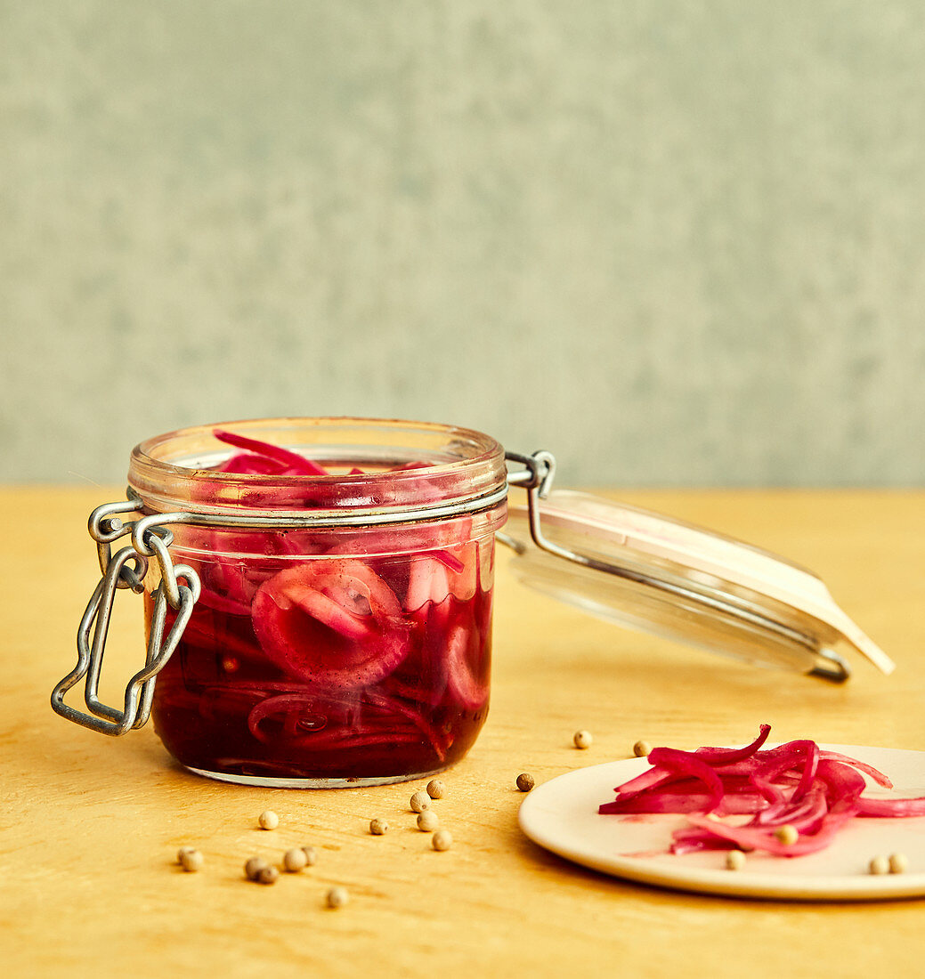 Pickled red onions in a jar