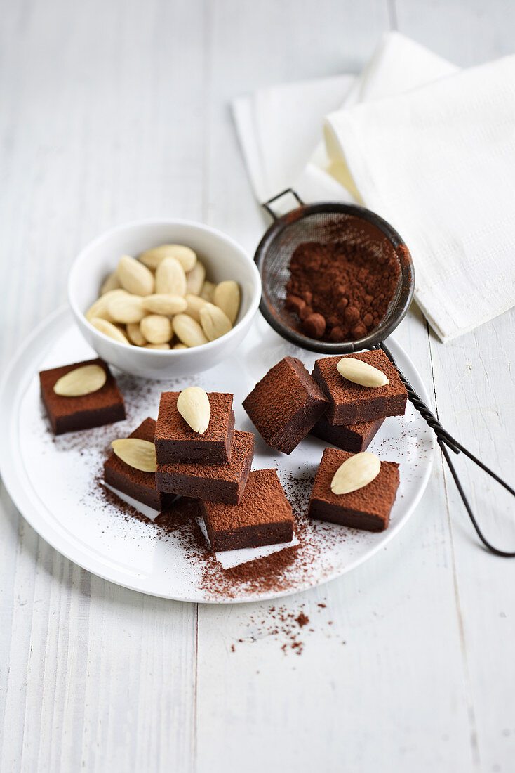 Square chocolate truffles with almonds