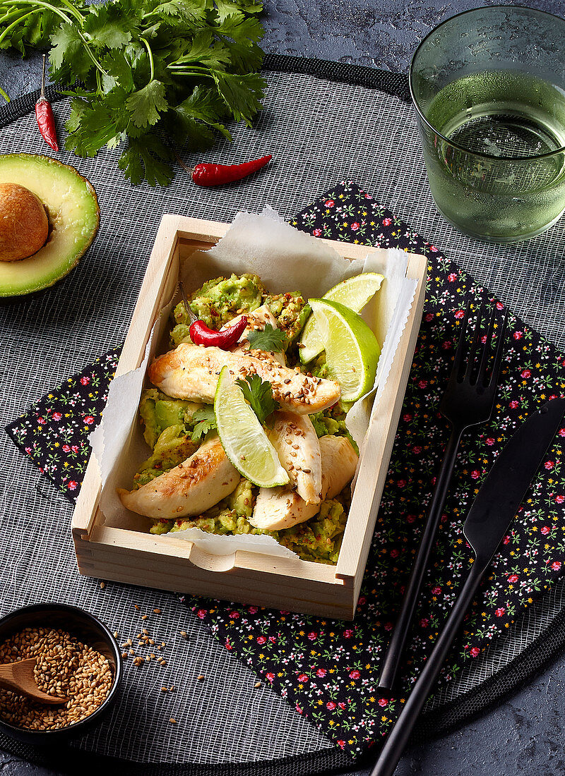 Lemon chicken with avocado in a bento box