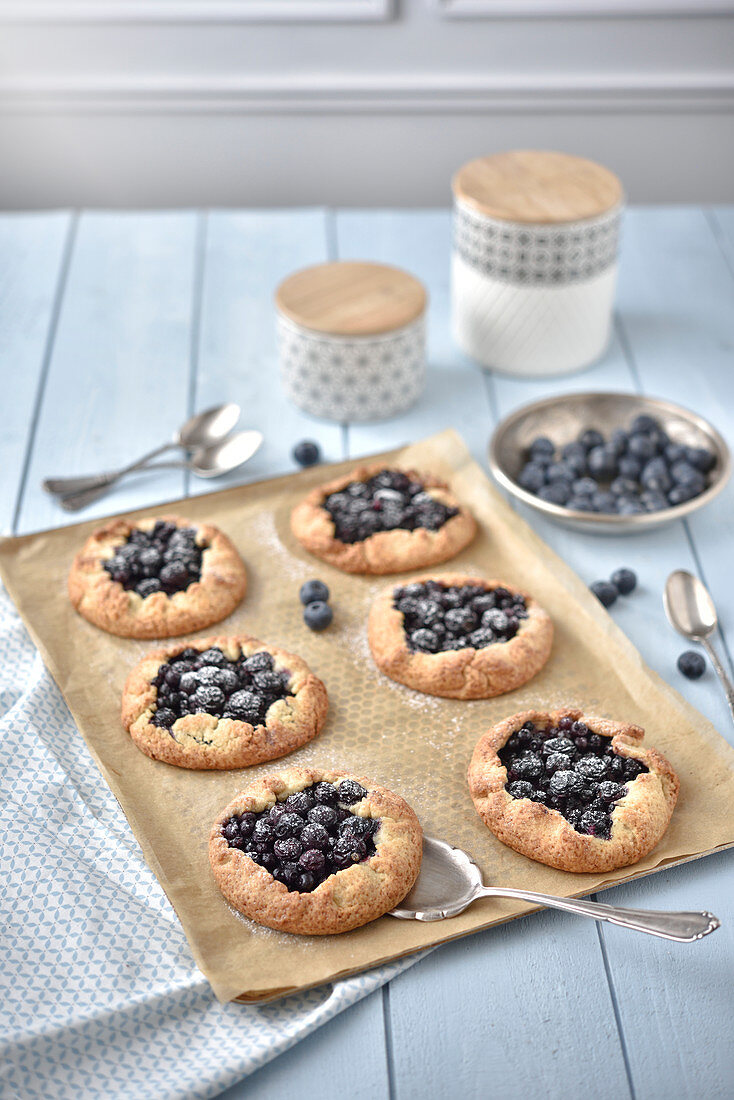Blueberry tartlets on baking paper