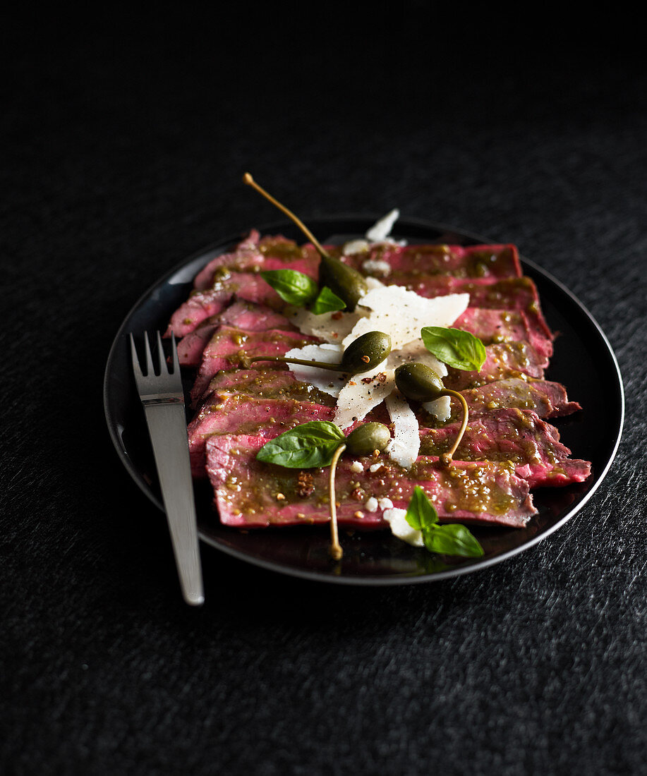 Sliced beef with capers and parmesan cheese